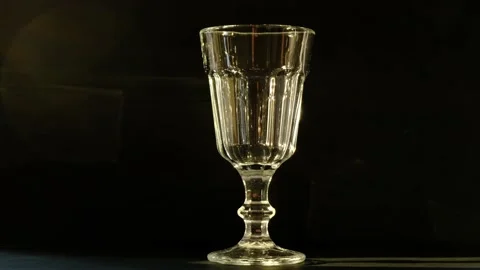 Glass of wine on a dark background Stock-Footage 130536228