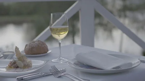 A glass of wine with dinner Video stock 74067170