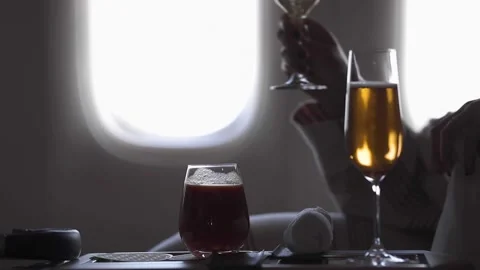 A glass of wine sitting on top of a table Video stock 155453994