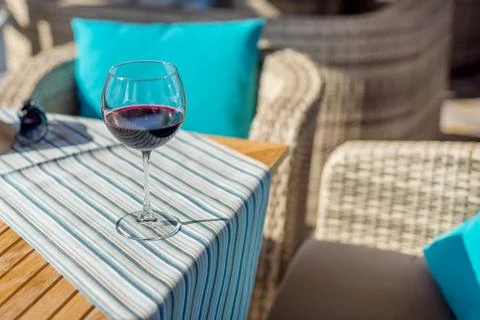 Glass of wine on the table Stock Photos