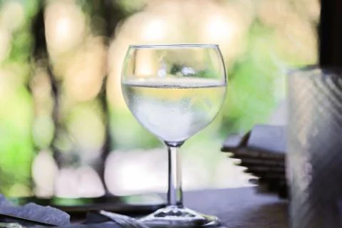 Glass with wine on the table Stock Photos