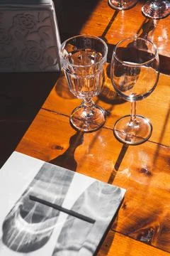 A glass of wine on a table Stock Photos