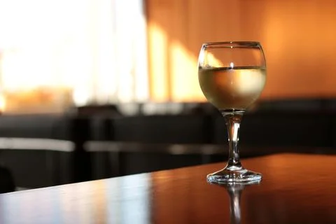 Glass of wine on the table Stock Photos