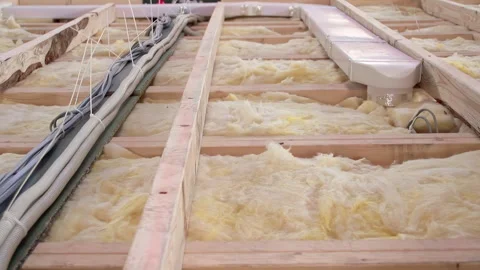 Glass Wool Insulation and Electrical Wiring in Wooden Frame Structure Stock Footage 329144759