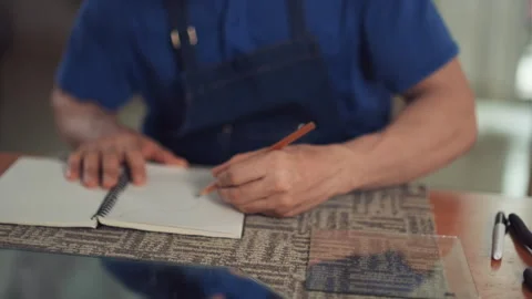 Glass Workshop Worker Drawing Sketch in His Notepad Stock Footage 250341479