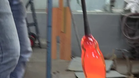 Glassblowing workshop glowing hot oven glassblower getting rod out of oven 4k Stock Footage