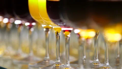 Glasses with alcohol and different drinks, glasses of wine and juice are on the Stock-Footage 99167075