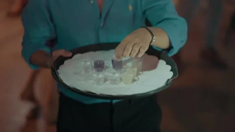Glasses with alcohol on a tray Video stock 221018134