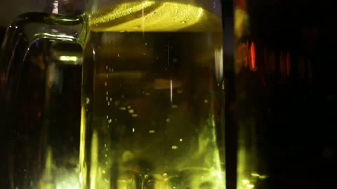 Glasses with ale stand on the table close-up, gas bubbles rise up. Real-time, ev Stock Footage 87425819
