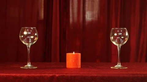 Glasses and candle on a table Video stock 89258023