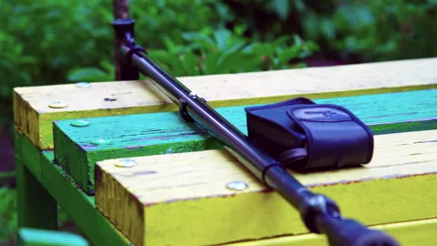 Glasses and a cane lie on a bench Stock Footage 207666761