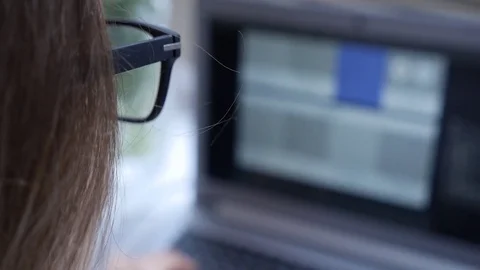 Glasses and laptop web designer work Stock Footage 74872207