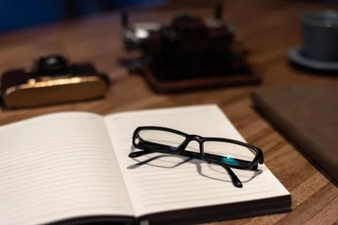 Glasses and notebook Stock Photos
