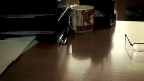 Glasses are on the desktop in the office Stock Footage 104669252