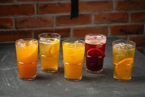 Glasses of assorted fruit lemonade beverages Stock Photos