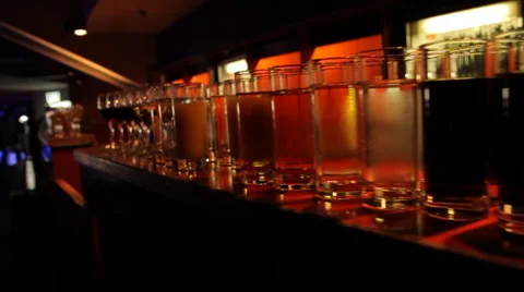 Glasses on a bar Stock Footage 64126962