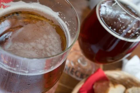 Glasses of beer and bread on the table in a bistro in Strasbourg Stock Photos