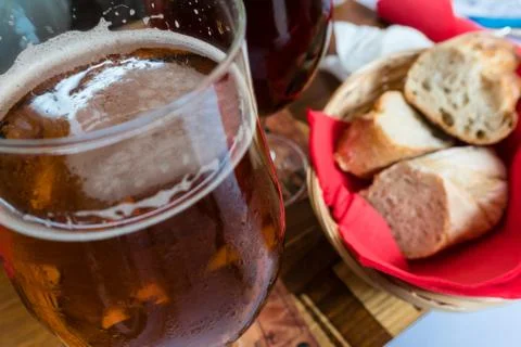 Glasses of beer and bread on the table in a bistro in Strasbourg Stock Photos