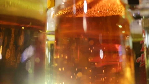 Glasses of beer are on the table close-up. The gas bubbles trickle up. Real time Stock Footage 87426045