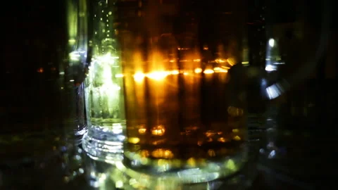 Glasses of beer are on the table close-up. Real-time, indoors, evening Stock Footage 87477619