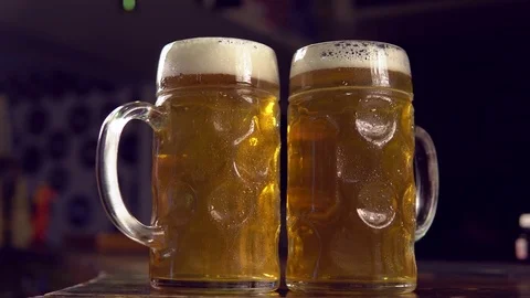 Glasses of beer on bar counter Stockbeeldmateriaal 84817402