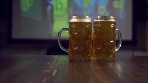Glasses of beer on bar counter Stockbeeldmateriaal 84817422