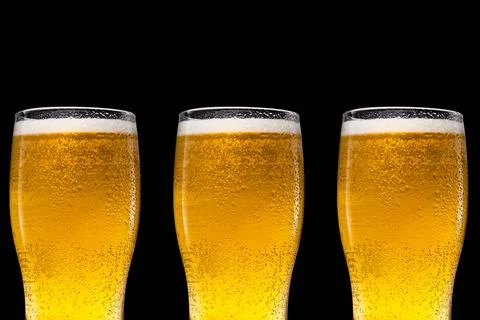 Glasses of beer on black background Stock Photos
