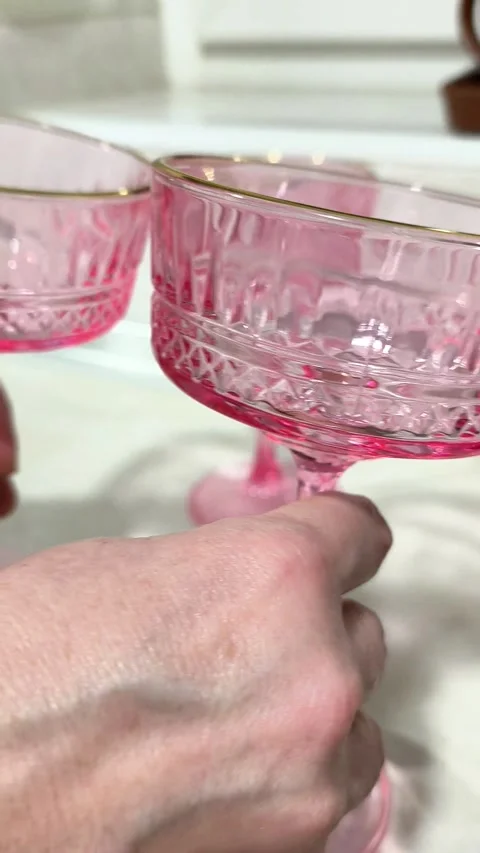Glasses being placed on table by hand in indoor setting, Stock Footage 335394590