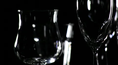 Glasses on black background. The camera motion in a circle Stock Footage 52933242