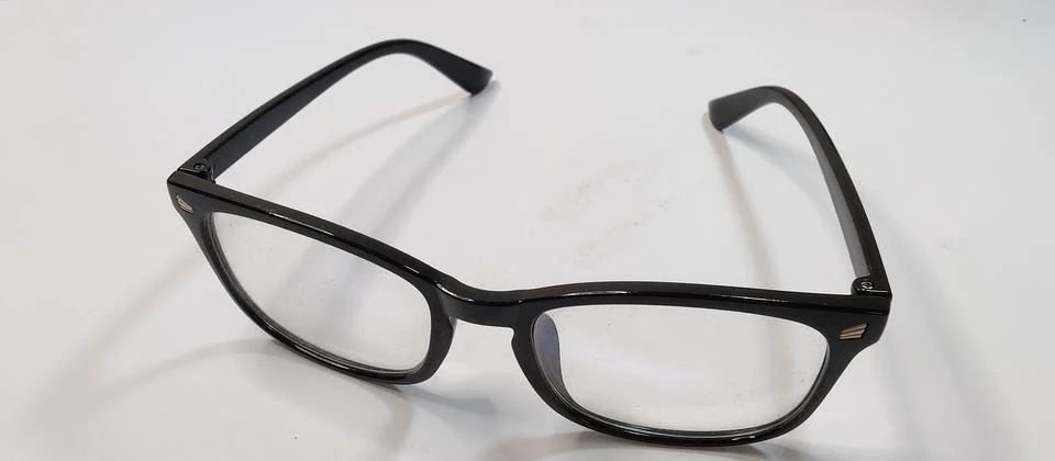 Glasses in black frames on a white background Stock Photos