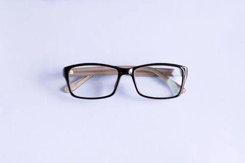 Glasses in a black rectangular frame shot close-up on a light background Foto stock