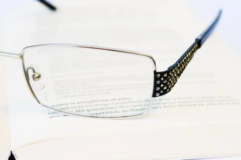 Glasses with book close-up Stock Photos