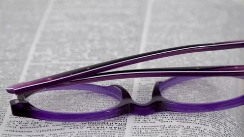 Glasses on the book Stock Footage 141373547