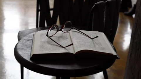 Glasses on the book Stock Footage 161873559