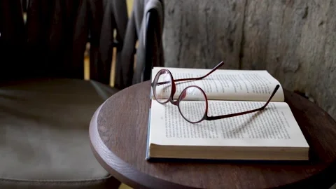 Glasses on the book Stock Footage 161873563