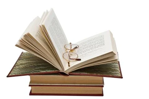 Glasses in the book. Stock Photos