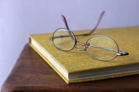 Glasses with book Stock Photos