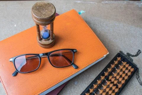 Glasses on a book Stock Photos