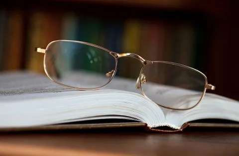 Glasses on a book Stock Photos