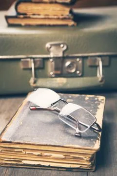 Glasses on the book Stock Photos