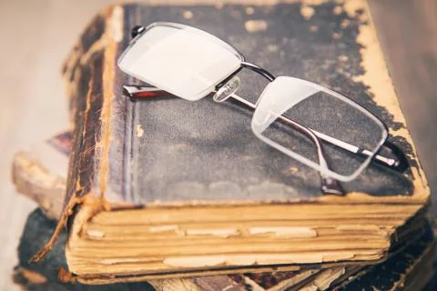 Glasses on the book Stock Photos