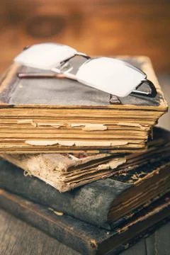 Glasses on the book Stock Photos