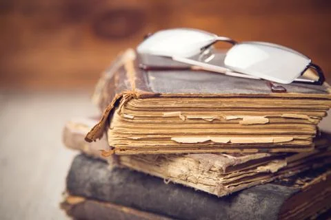 Glasses on the book Stock Photos