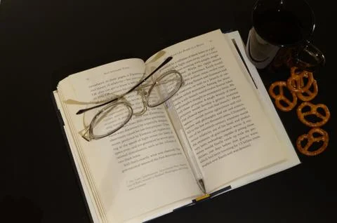 Glasses on book Stock Photos