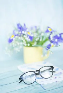 Glasses on a book Stock Photos