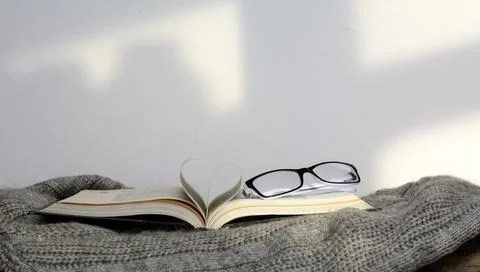 Glasses on the book Stock Photos