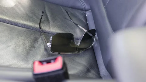 Glasses on a car seat. Stock Footage 336296002
