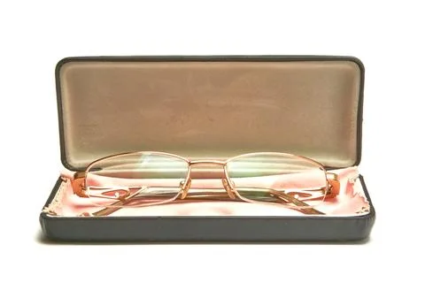 Glasses in a case on a light background. Stock Photos