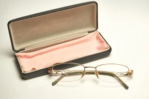 Glasses in a case on a light background. Stock Photos
