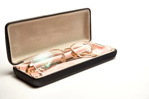 Glasses in a case on a light background. Stock Photos